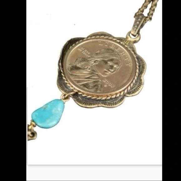 blue turquoise quarter dollar pendant hangs on a 24” gold tone necklace